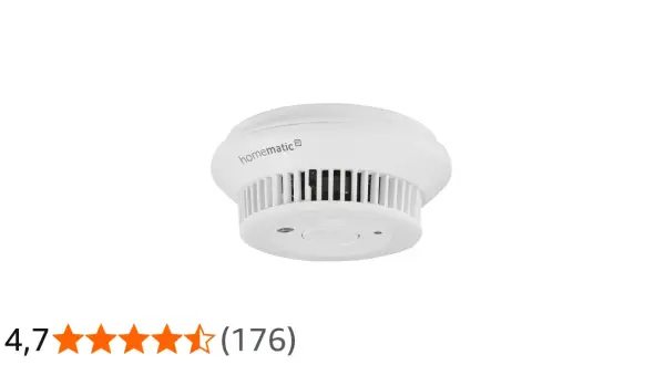 Homematic IP Rauchmelder im Test: Ein weißer, runder Rauchmelder mit Lüftungsschlitzen und einem zentralen Knopf.